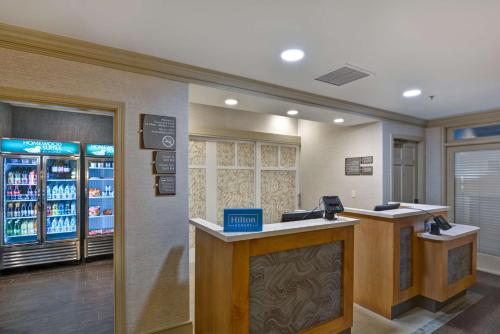 a waiting room at a store with a cash register at Homewood Suites by Hilton Windsor Locks Hartford in Windsor Locks