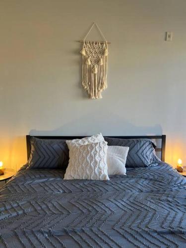 a bed with two pillows on top of it at Studio Townhouse in Uptown King Bed-Wi-Fi-Full Kitchen- Washer & Dryer in Charlotte