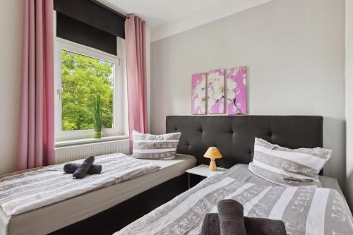 Giường trong phòng chung tại Schönes Ferien-Appartement für bis zu 6 Personen