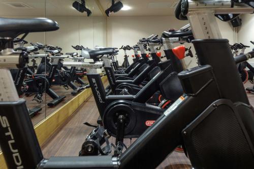 a room filled with rows of exercise bikes at Glasgow Westerwood Hotel, Spa & Golf Resort in Cumbernauld