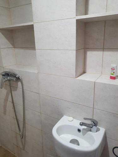 a bathroom with a sink and a shower at Becejły HILLS in Szypliszki
