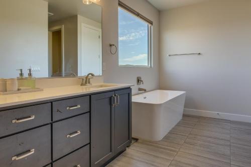 a bathroom with a tub and a sink and a bath tub at Washington Home with Pool Access about 32 Mi to Zion NP! in Washington
