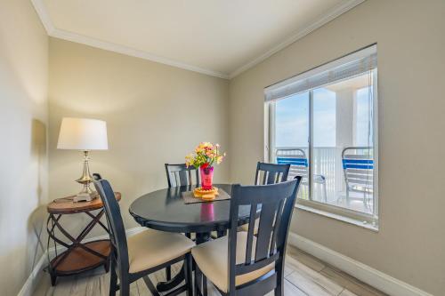 a dining room with a table and chairs and a window at Emerald on the Water - Formerly Belleair Beach Club in Clearwater Beach