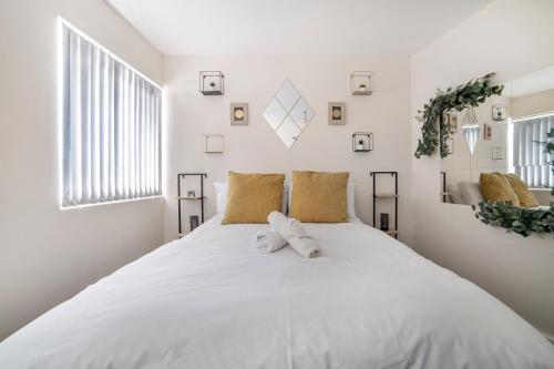 a white bedroom with a large white bed at Leicester City Center The Boat House Building in Leicester