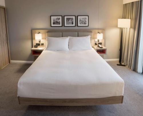 a large white bed in a hotel room at Hilton Garden Inn Manchester Emirates Old Trafford in Manchester