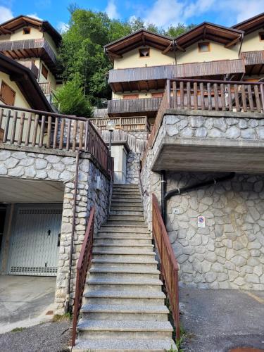 a stairway leading up to a house with two gates at Casa Ettore in Lizzola Alta