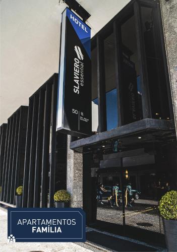 a sign on the side of a building at Slaviero Curitiba Centro in Curitiba