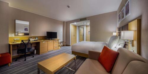 a hotel room with a bed and a desk at Hilton Garden Inn Safranbolu in Safranbolu