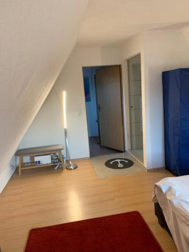 a bedroom with a bed and a room with a table at Ferienhaus in Lassan vor Usedom in Lassan