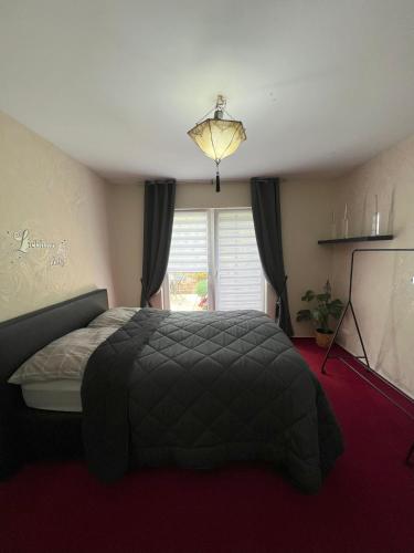 Katil atau katil-katil dalam bilik di Ferienwohnung "Im Herzen des Westerwalds"