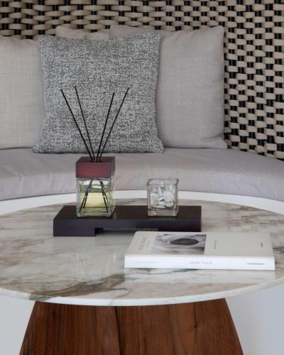a living room with a coffee table with a couch at Sulià House Porto Rotondo, Curio Collection by Hilton in Porto Rotondo