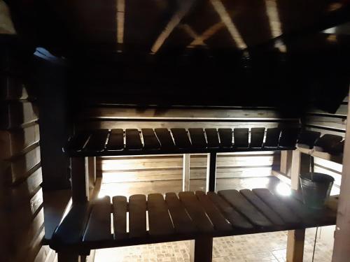 a bench in an oven with the light coming in at Brīvdienu māja Mētriņi in Ķekava