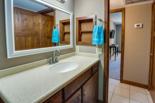 a bathroom with a sink and a mirror at Cozy Condo with Resort Perks - Half Mi to Beach! in Lake Havasu City