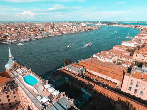 an aerial view of a city and a river at Hilton Molino Stucky Venice in Venice