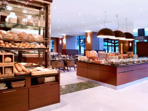 a bakery with bread and pastries on display at Hilton Antwerp Old Town in Antwerp