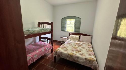 Ένα ή περισσότερα κρεβάτια σε δωμάτιο στο Casa Alpe de Itapeva