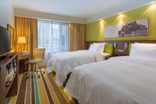 Posteľ alebo postele v izbe v ubytovaní Hampton by Hilton Warsaw City Centre