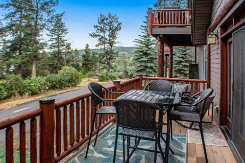 a patio with chairs and a table on a balcony at Juniper Bay Getaway in Somers