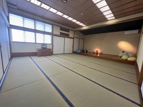 a large room with a bowling alley with a table at Fukuro no Oyado Shinkan - Vacation STAY 21360v in Fuefuki