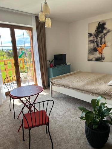 Ένα ή περισσότερα κρεβάτια σε δωμάτιο στο ApartLiv