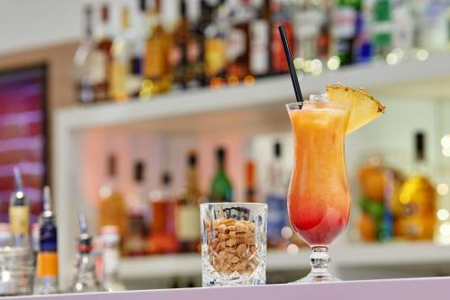 a drink sitting on a table with at Hampton by Hilton Berlin City Centre Alexanderplatz in Berlin