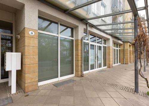an empty building with glass doors on the side at Studioatelier in Übigau in Dresden