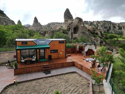 a tiny house in front of a mountain at Cappatiny House in Goreme