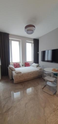 a bedroom with a large bed and a table at Pink Maison Milano Centro Piazza Diaz Duomo in Milan