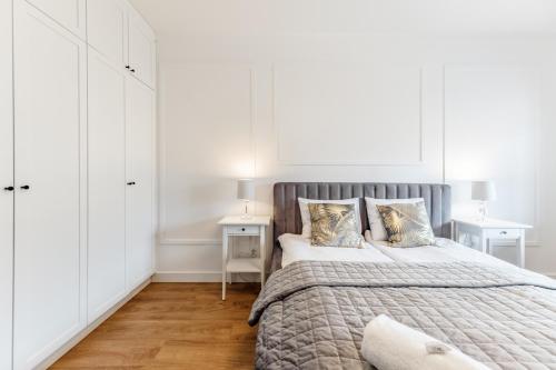 Ένα ή περισσότερα κρεβάτια σε δωμάτιο στο Aparthotel Plac Litewski Premium