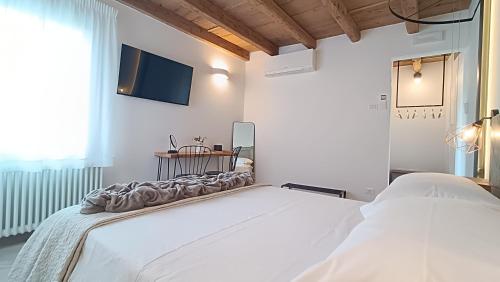Postel nebo postele na pokoji v ubytování Casa Cuccagna Chioggia - Vista Canal Vena