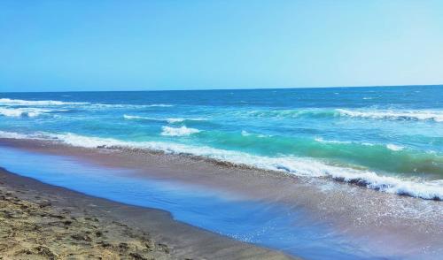 a view of the beach with the ocean at Casa Annalisa in Scauri