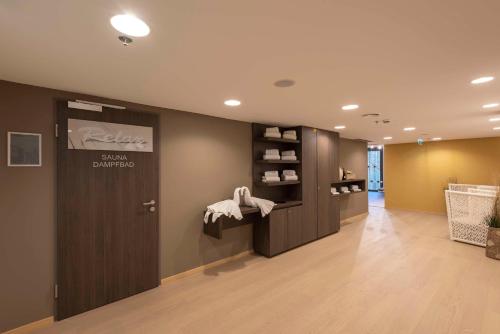 a dental office with a door in a room at Doubletree by Hilton Vienna Schonbrunn in Vienna
