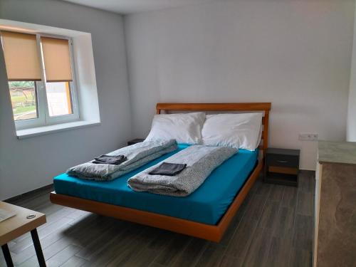 Postel nebo postele na pokoji v ubytování Horizont