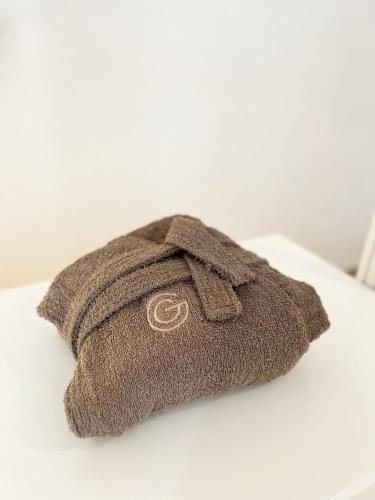 a brown hat sitting on top of a table at Mariamora Apartment in Bari