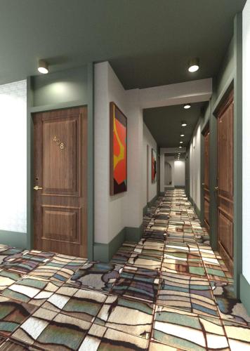 a hallway with a tile floor and wooden doors at Marty Hotel Bordeaux - Tapestry Collection by Hilton in Bordeaux