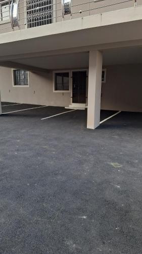 an empty parking lot in front of a building at 11 on CROMPTON OVERPORT HALAAL in Durban