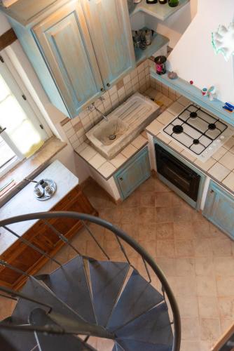 an overhead view of a kitchen with blue cabinets at Opera d'Oro in Piegaro