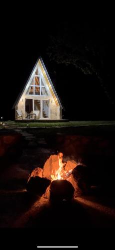 a small house with a fire in front of it at Vukova dolina apartments in Cetinje