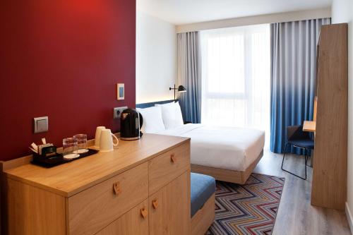 Un ou plusieurs lits dans un hébergement de l'établissement Hampton by Hilton Munich Airport South