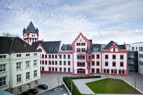 a group of buildings in a city at Hampton By Hilton Dortmund Phoenix See in Dortmund