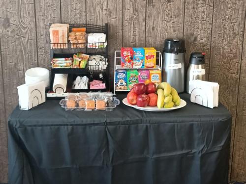 a black table with a plate of fruit on it at Town House Motor Inn in Worland