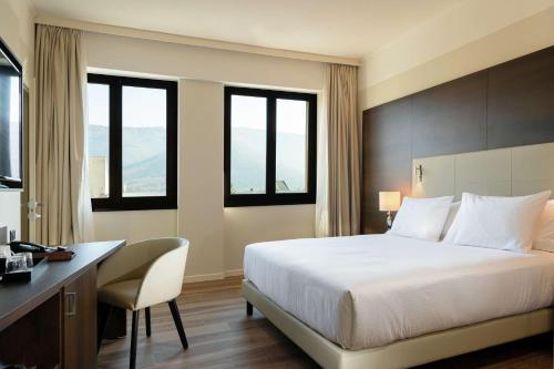 DoubleTree by Hilton Bresciaにあるベッド