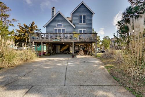 a large house with a large deck on a driveway at Hot Tub, Pirate Fort and Fire Pit Outer Banks Home! in Nags Head
