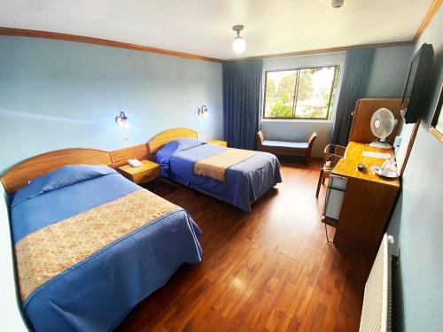 Posteľ alebo postele v izbe v ubytovaní Hotel Tierra del Sur