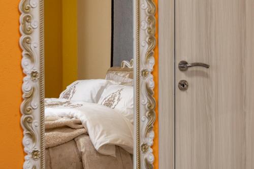 a reflection of a bed in a mirror at Aparthotel AA in Sarajevo