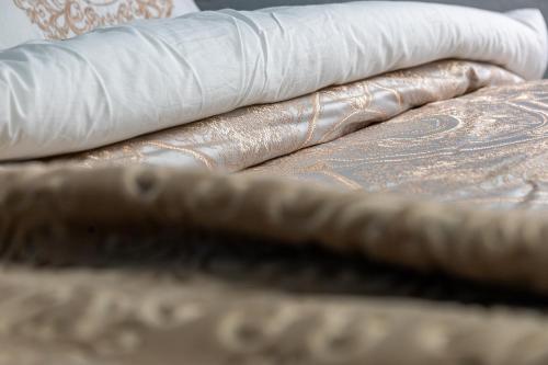 a pile of brown and white blankets and paper towels at Aparthotel AA in Sarajevo