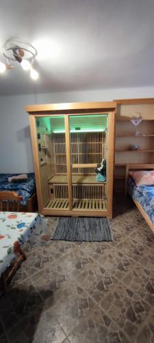 a room with a cage in the middle of a room at Chalupa u Kolčavy in Volenice