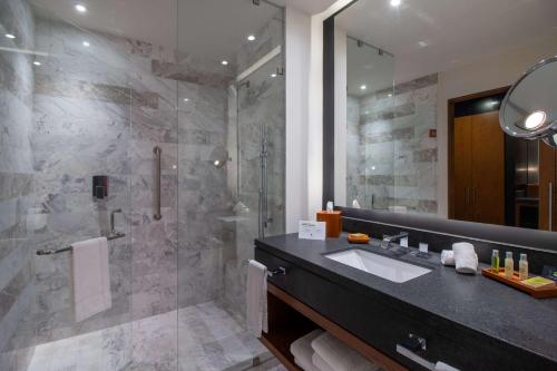 a bathroom with a sink and a shower at Doubletree By Hilton Celaya in Celaya