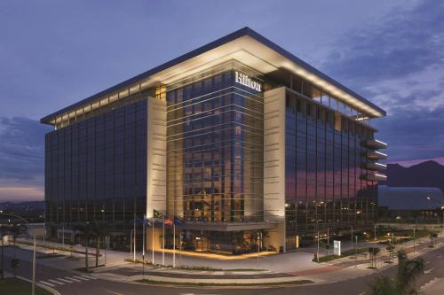a large office building with a lot of windows at Hilton Barra Rio de Janeiro in Rio de Janeiro