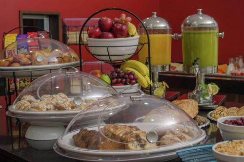 a buffet with many different types of food on a table at Hilton Garden Inn Tuxtla Gutierrez in Tuxtla Gutiérrez